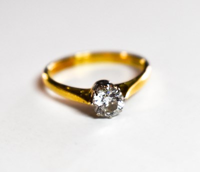 Lot 69 - An 18ct gold and diamond solitaire ring, the...