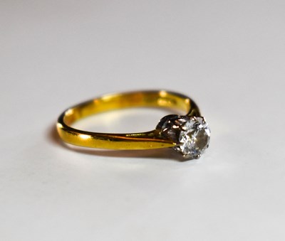 Lot 69 - An 18ct gold and diamond solitaire ring, the...