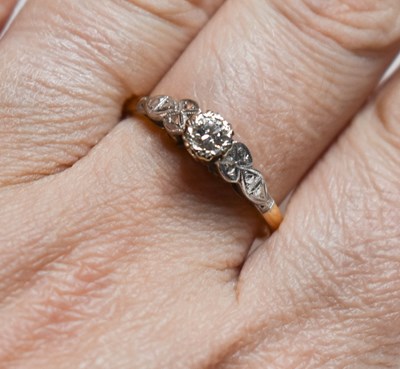 Lot 50 - An 18ct gold and diamond ring, size Q, 2.9g.