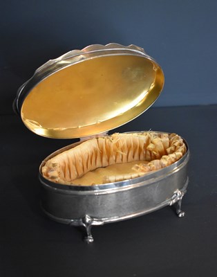 Lot 301 - A silver jewellery box of oval form, with a...