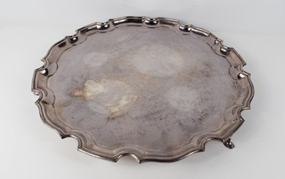 Lot 291 - A large silver salver with scalloped rim,...