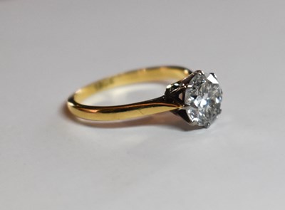Lot 78 - An 18ct gold and diamond solitaire ring, the...