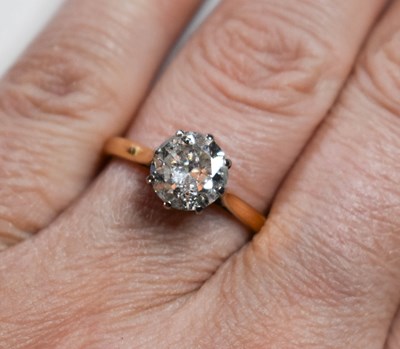 Lot 78 - An 18ct gold and diamond solitaire ring, the...