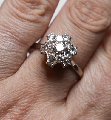 Lot 74 - A diamond cluster ring, the brilliant cut...
