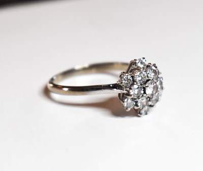 Lot 74 - A diamond cluster ring, the brilliant cut...