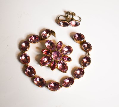 Lot 210 - A vintage pink paste bracelet, the oval cut...