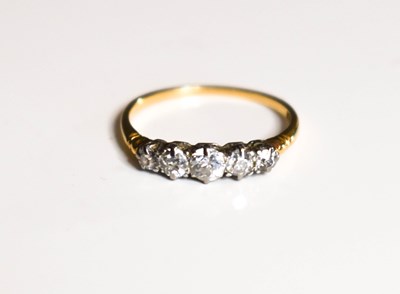 Lot 36 - An 18ct gold and diamond five stone ring,...