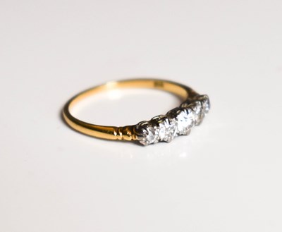 Lot 36 - An 18ct gold and diamond five stone ring,...