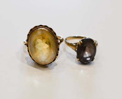 Lot 9 - A 9ct gold ring set with an oval cut citrine,...