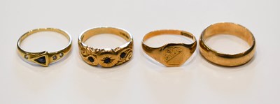 Lot 52 - A group of three 9ct gold rings comprising a...