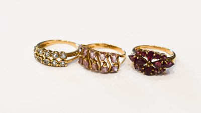 Lot 29 - A group of three 9ct gold dress rings, one set...