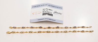 Lot 121 - A 9ct gold and Tanzanite bracelet, set with...