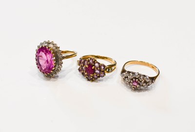 Lot 32 - A group of three 9ct gold rings set with pink...