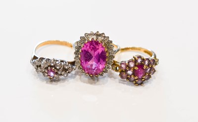 Lot 32 - A group of three 9ct gold rings set with pink...