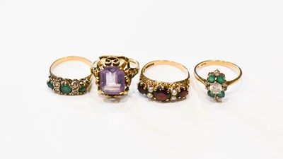 Lot 33 - A group of four 9ct gold rings comprising a...