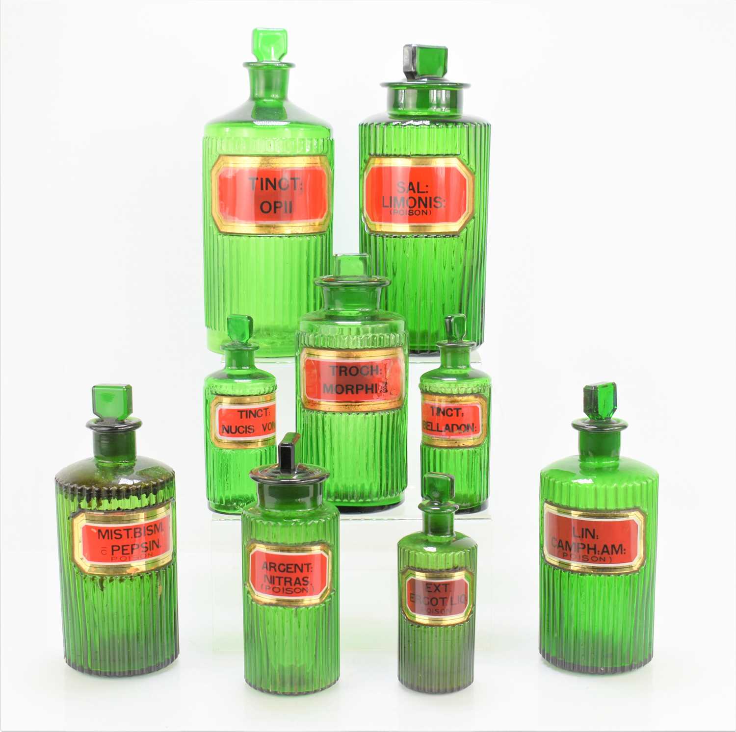 Lot 3 - A group of nine antique green glass apothecary...