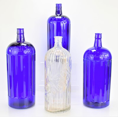 Lot 36 - Three large blue glass poison bottles together...