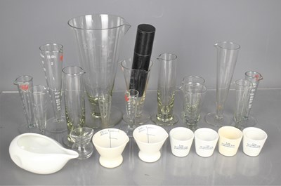 Lot 27 - A group of vintage glass and ceramic measures...