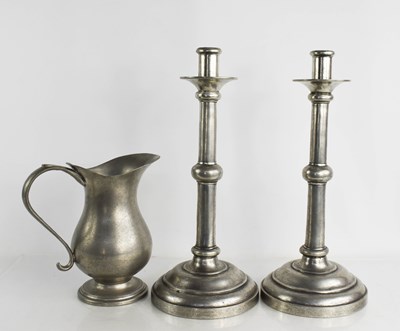 Lot 317 - A pair of 19th century pewter candlesticks...