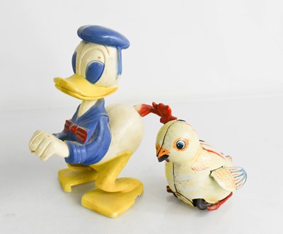 Lot 359 - A 1950s tinplate friction drive chirping chick,...