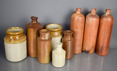 Lot 56 - A group of stoneware bottles and jars to...