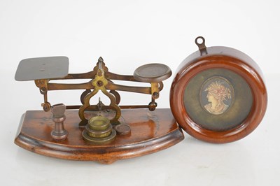 Lot 51 - A set of small postal scales with five weights...