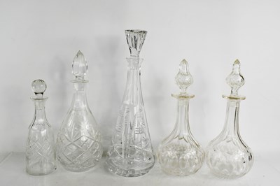 Lot 102 - Five cut glass decanters of various form to...