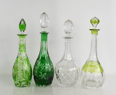 Lot 105 - Four cut glass decanters of various form,...