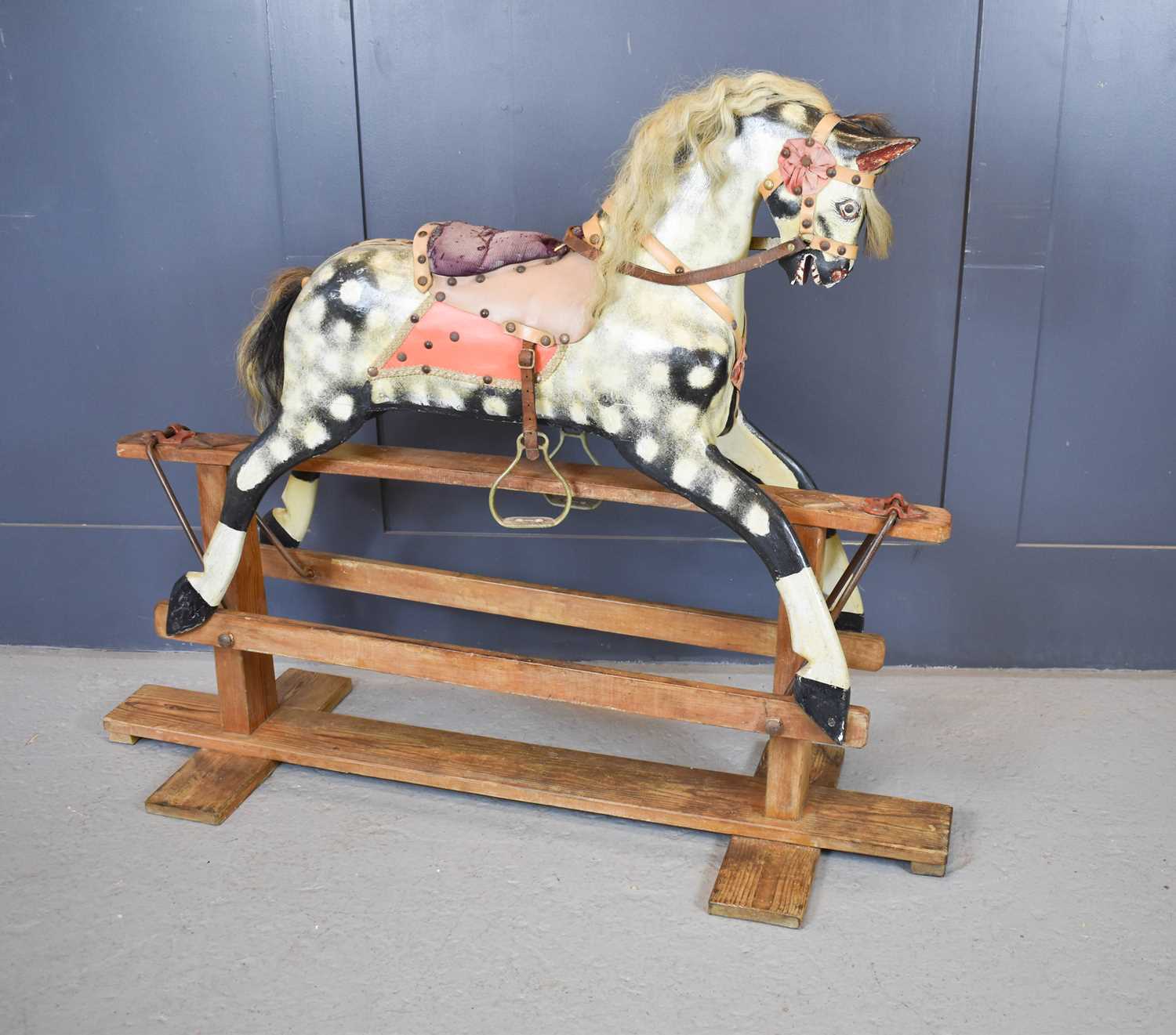 Lot 357 - An Edwardian dapple grey rocking horse, circa...