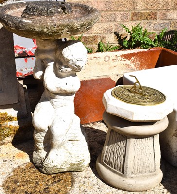 Lot 483 - A reconstituted garden stone bird bath in the...