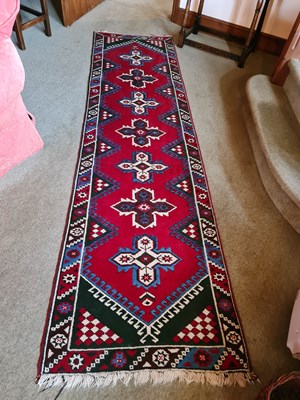 Lot 372 - An antique wool Middle Eastern runner, with...