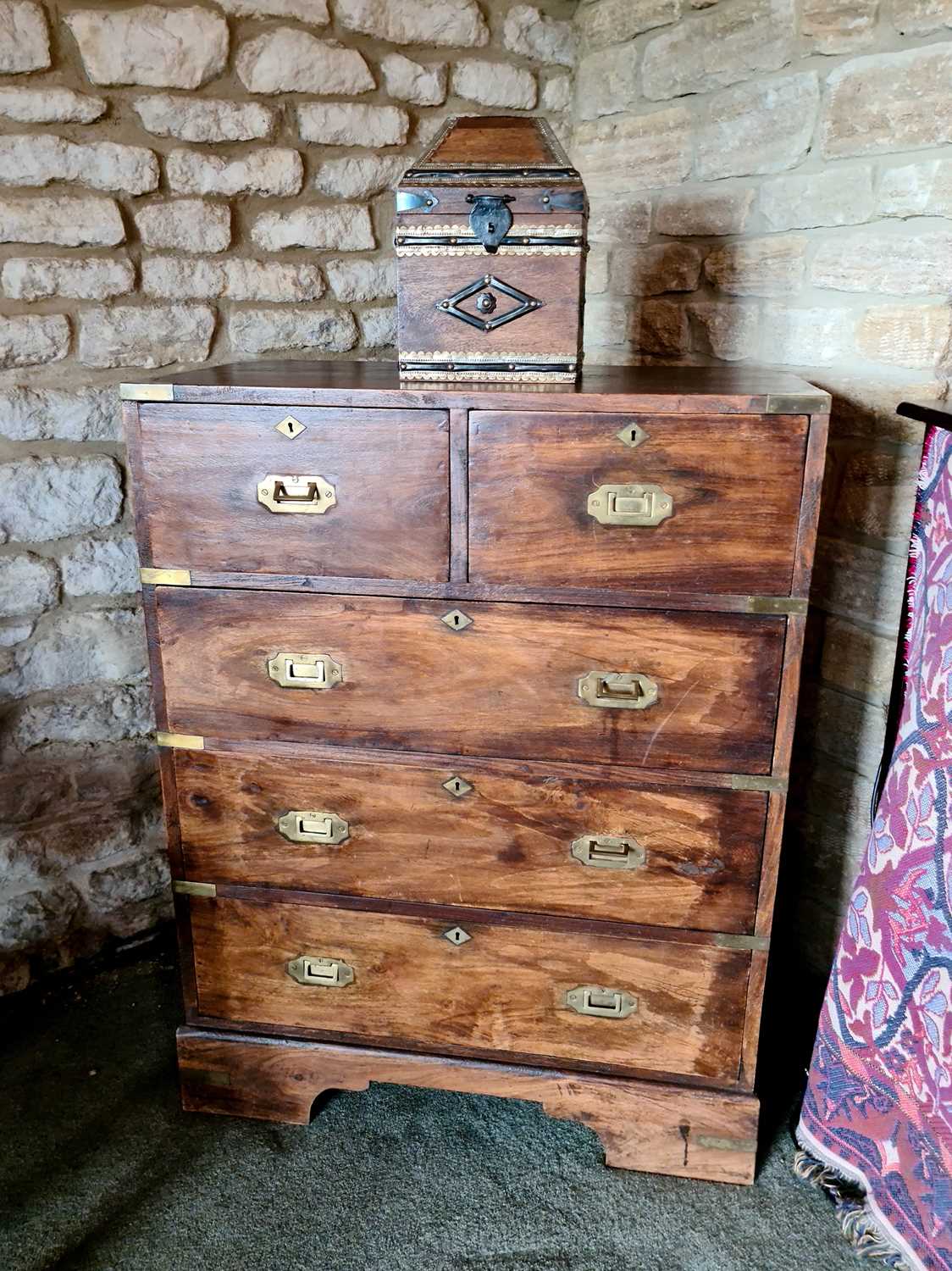 Lot 525 - A campaign style chest of drawers, the two...