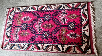 Lot 368 - A small red ground antique Middle Eastern rug...