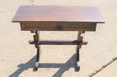 Lot 205 - An oak hall table, with frieze drawer carved...