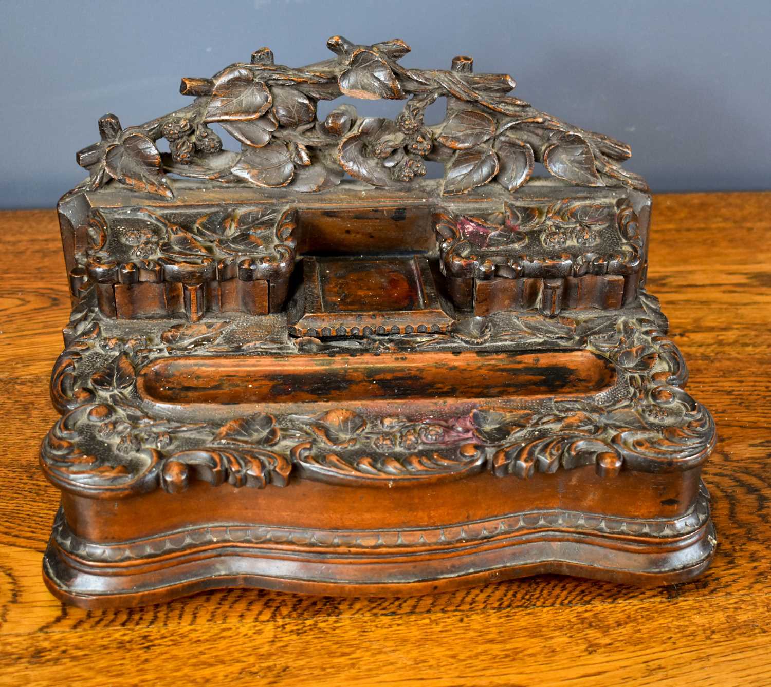 Lot 58 - A 19th century Blackforest inkwell, carved...