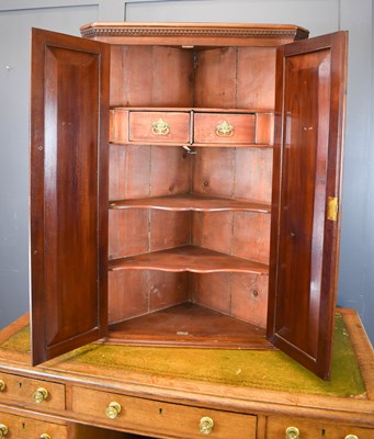 Lot 483 - A mahogany corner cupboard, with flame...