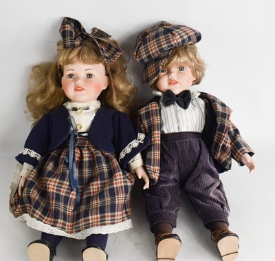 Lot 356 - A pair of dolls, boy and girl, with porcelain...