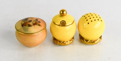 Lot 215 - A Royal Worcester salt and pepper with yellow...