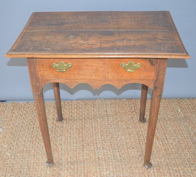 Lot 356 - An 18th century oak low-boy with two drawers...