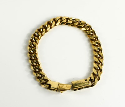 Lot 4 - A Cartier 9ct gold curb link bracelet, 18cm...