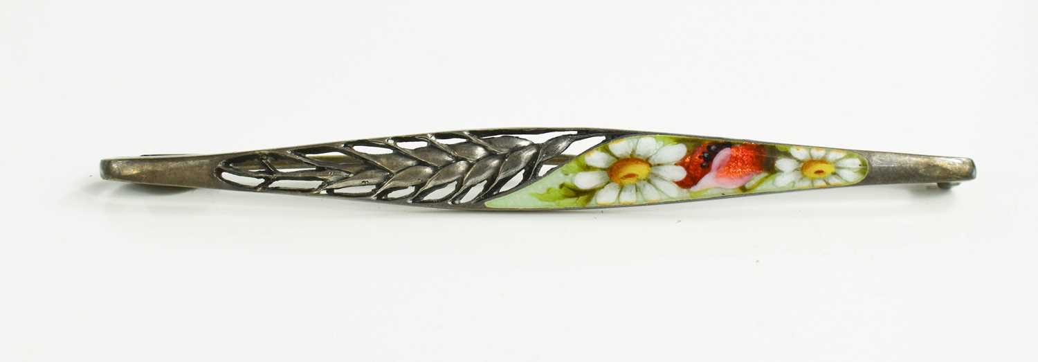 Lot 21 - A 935 silver and enamel brooch of bowed bar...