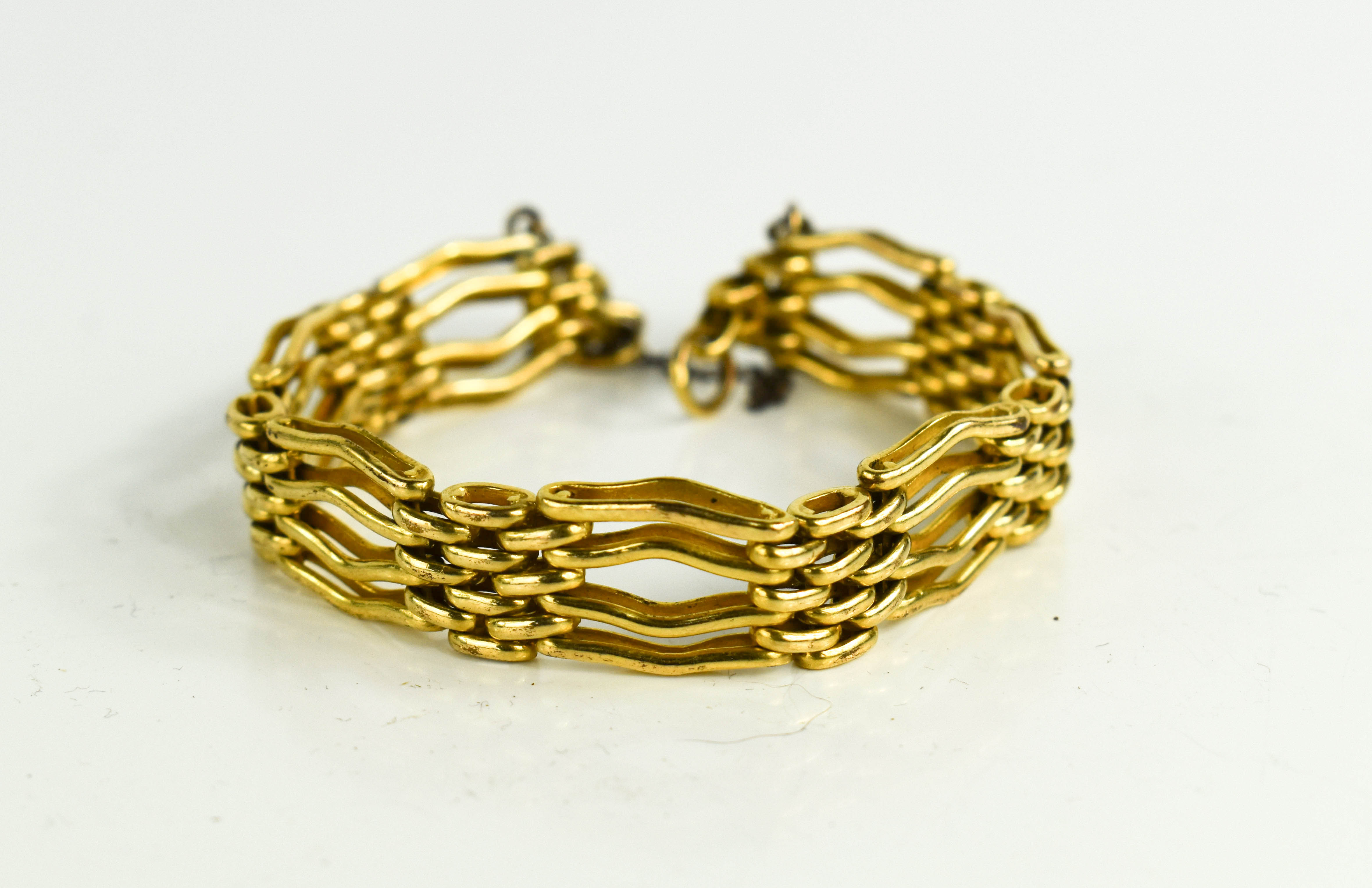 Lot 10 A vintage gold plated wavy gatelink bracelet,