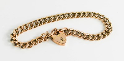 Lot 55 - A 9ct rose gold, curb link, charm bracelet,...