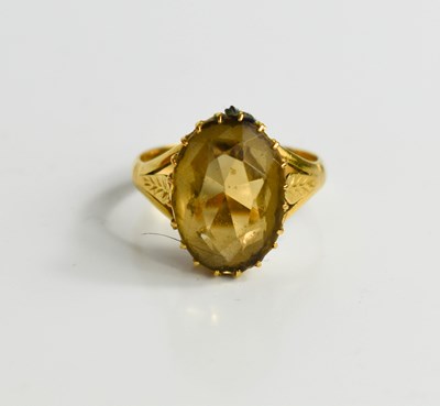 Lot 51 - A gold ring set with oval smoky quartz, 14.4...