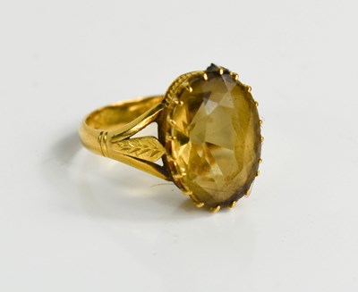 Lot 51 - A gold ring set with oval smoky quartz, 14.4...