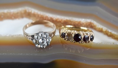 Lot 50 - An 18ct gold five stone ring set with four...