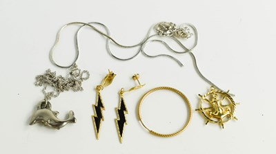 Lot 79 - A 9ct gold ships wheel and anchor pendant,...