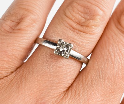 Lot 159 - A platinum and diamond solitaire ring, the...