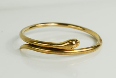 Lot 148 - A 9ct gold bangle in the form of a snake, 13.63g.