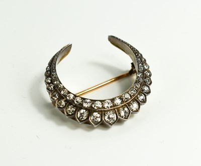 Lot 5 - A stunning French diamond and gold crescent...